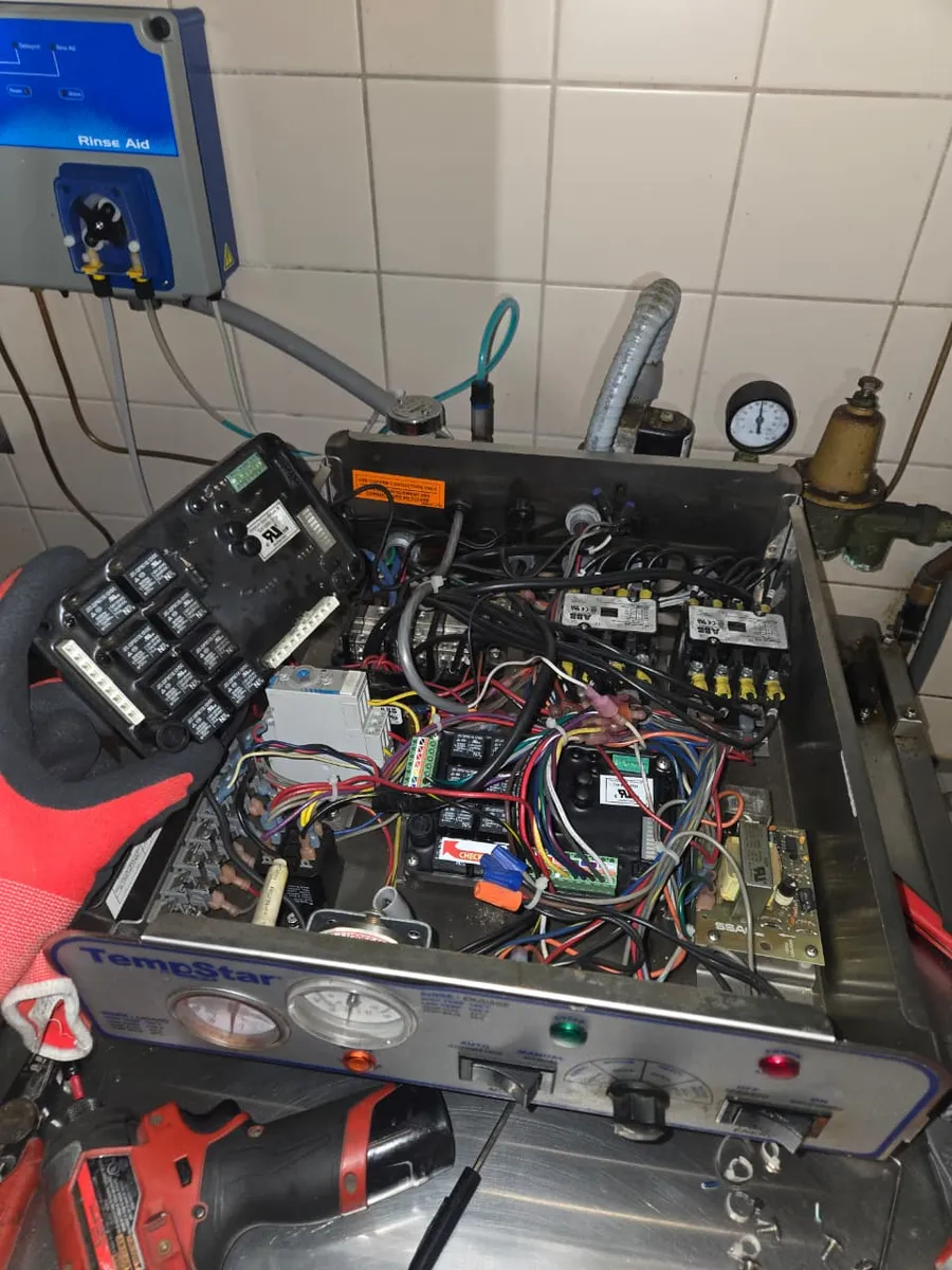 Commercial dishwasher control panel opened for relay and wiring repair by Epic Star in Hollywood, CA