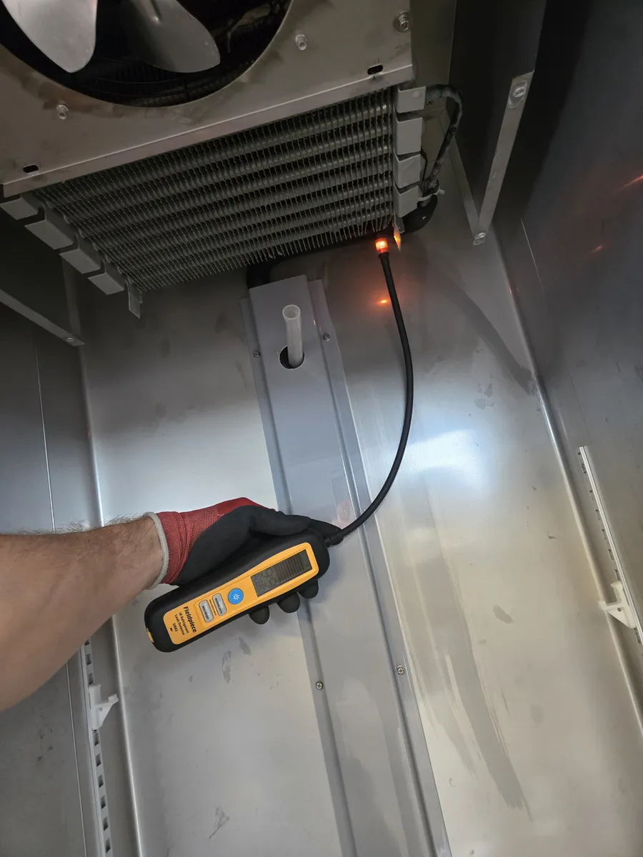 Epic Star technician locating an evaporator leak on a commercial refrigerator in Valley Village, CA