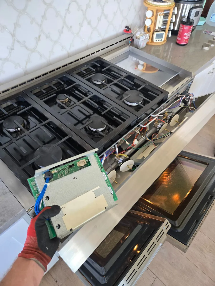 Epic Star technician installing a new control board in a gas range in Brentwood, CA