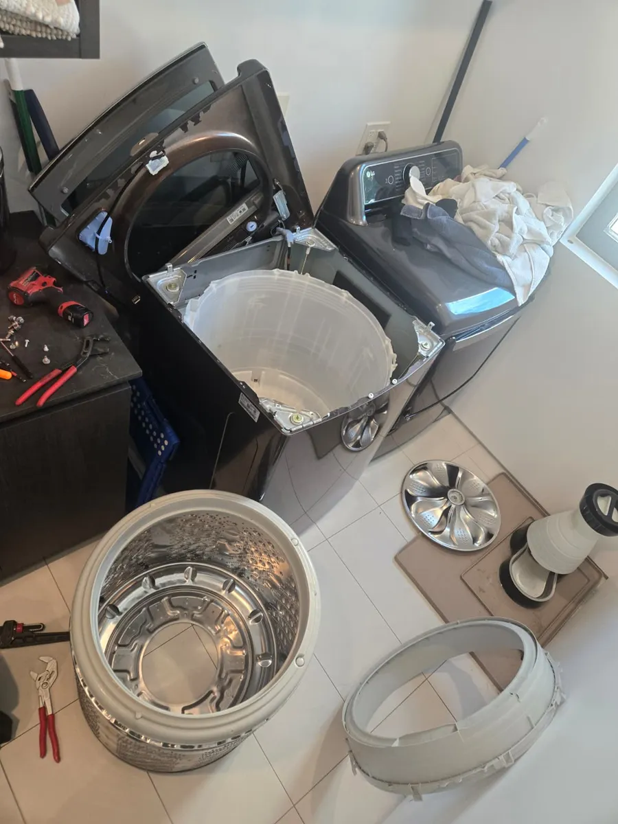 LG top-load washer fully disassembled for drum and seal repair by Epic Star in Culver City, CA