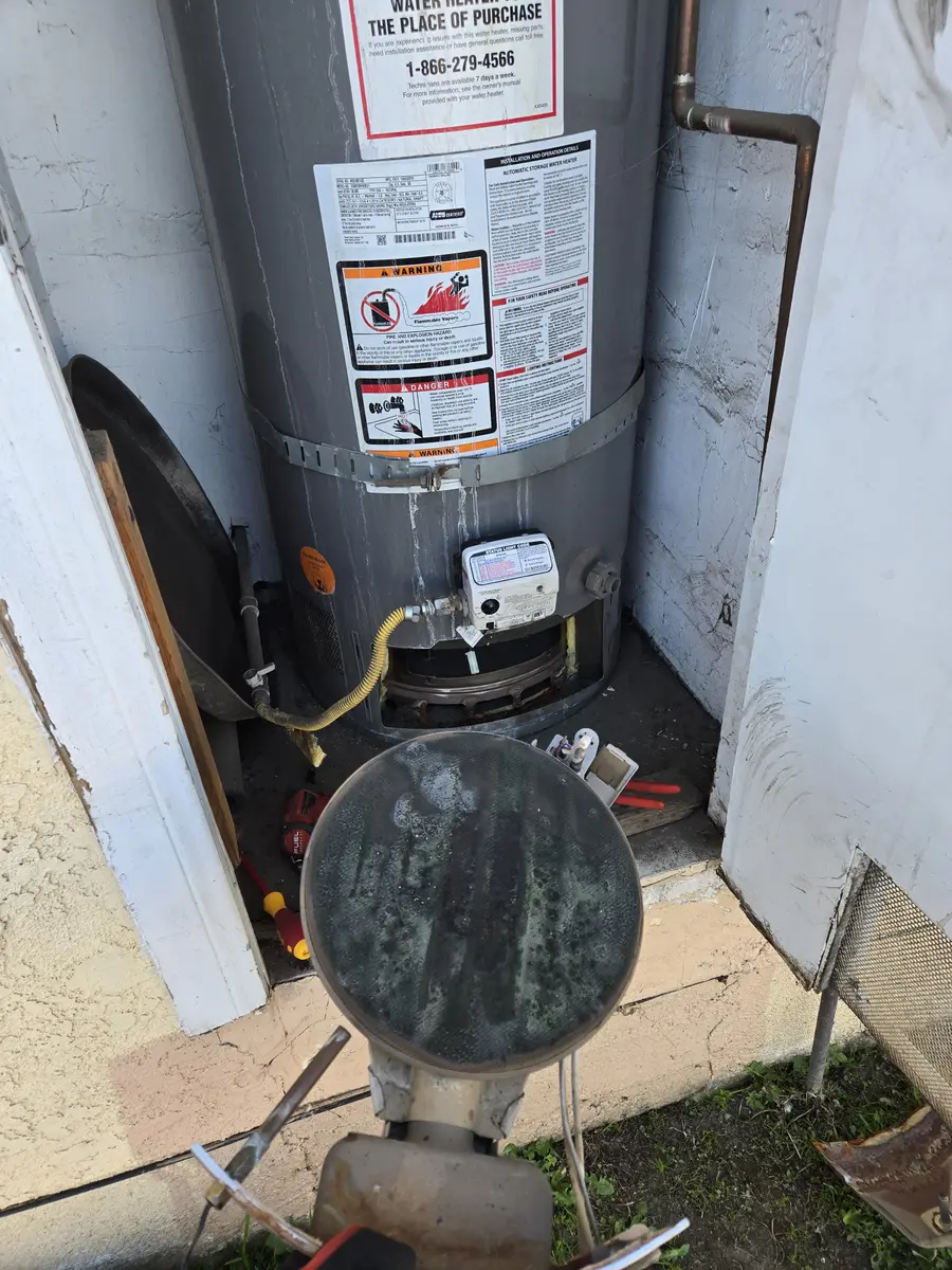Gas water heater with access panel removed and gas valve serviced by Epic Star in Tarzana, CA